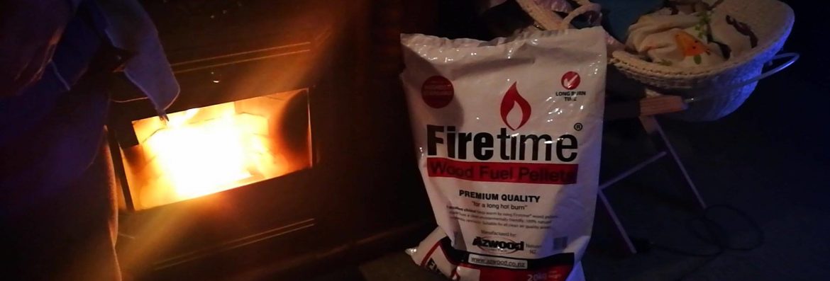 azwood energy fireplace with a bag of product next to it.
